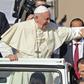 Pope Francis blesses a child as he arrives to lead a mass for an estimated 170,000 Catholics in Abu Dhabi during the first-ever papal visit to the Arabian Peninsula in February 2019