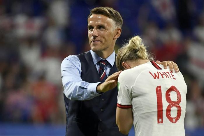 Coach Phil Neville comforts striker Ellen White after England's 2-1 defeat to the USA in the women's World Cup semi-final