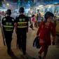 Police patrol a night food market near the Id Kah Mosque in Kashgar, in China's Xinjiang Uighur Autonomous Region, one day before the Eid al-Fitr holiday in June 2017