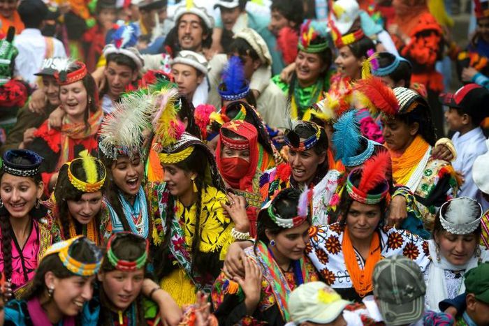 In a remote valley in Pakistan dozens of Kalash minority women dance to celebrate spring's arrival -- but as a gaggle of men scramble to catch them on camera, the community warns an influx of domestic tourists is threatening their unique traditions