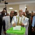 Presidential candidate Mohamed Ould Ghazouani (C) officially won the disputed Mauritanian election