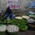 A Pakistan shopkeeper arranges vegetables in his shop at a market in Karachi in June 2019
