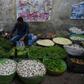 A Pakistan shopkeeper arranges vegetables in his shop at a market in Karachi in June 2019