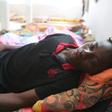 Malian migrant Souleyman Coulibaly is one of four people rescued after their boat capsized off Tunisia crossing the Mediterranean from Libya to Italy but more than 80 others are missing