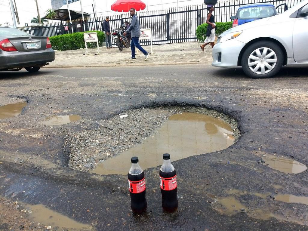 ‘Generous’ lawyer throws party for potholes in front of Zenith Bank for getting “bigger and deeper”