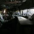 A Ukrainian serviceman monitors the positions of Russia-backed separatists