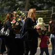 People attend the funeral of Salvadoran migrant Oscar Martinez and his toddler daughter Valeria, who both drowned while trying to cross the Rio Grande from Mexico to the United States, at La Bermeja cemetery in San Salvador on July 1, 2019