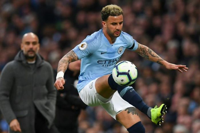 Kyle Walker (right) has become a key player for Manchester City under Pep Guardiola (left)