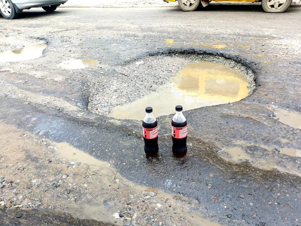 ‘Generous’ lawyer throws party for potholes in front of Zenith Bank for getting “bigger and deeper”