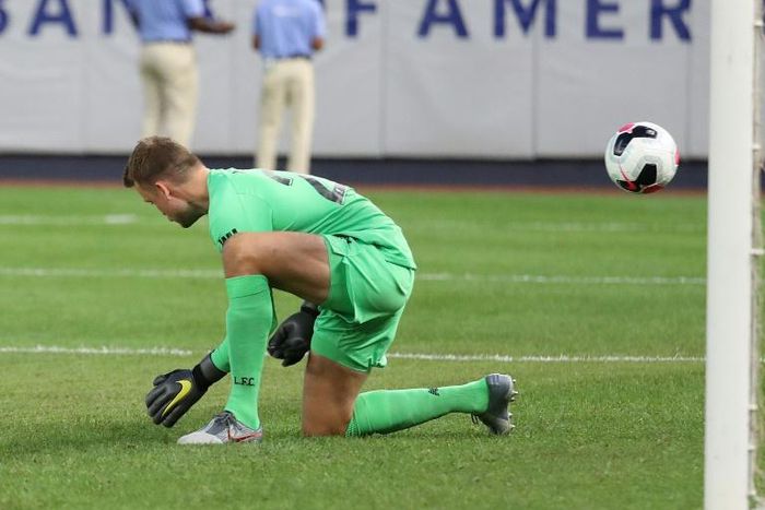 Liverpool's Simon Mignolet mishandles a shot from Sporting CP's Bruno Fernandes that leads to a goal in their pre-season friendly match at Yankee Stadium