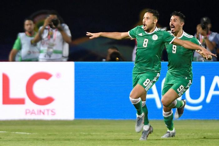 Youcef Belaili (L) celebrates his goal against Senegal