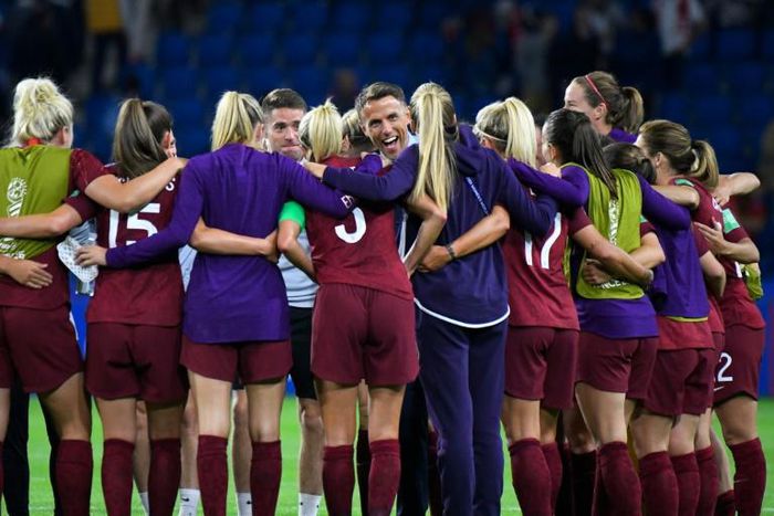 Phil Neville (C) hailed the togetherness of his England side after they joined Germany, France and Italy in the last 16 of the Women's World Cup