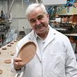 Polish inventor and entrepreneur Jerzy Wysocki holds a wheat bran plate he invented 15 years ago at the Biotrem factory in Zambrow, Poland
