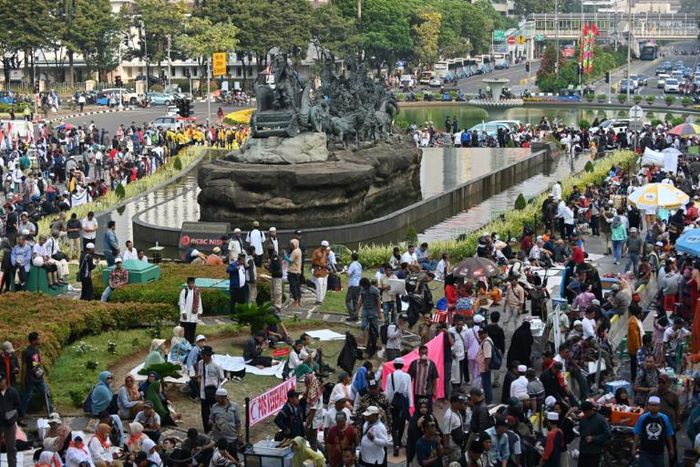 Supporters of ex-general Prabowo Subianto gathered to listen to the verdict broadcast on speakers near the constitutional court