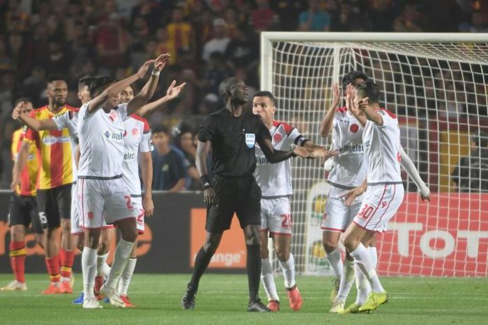 Wydad Casablanca players protest after having a goal disallowed in the 2019 CAF Champions League final