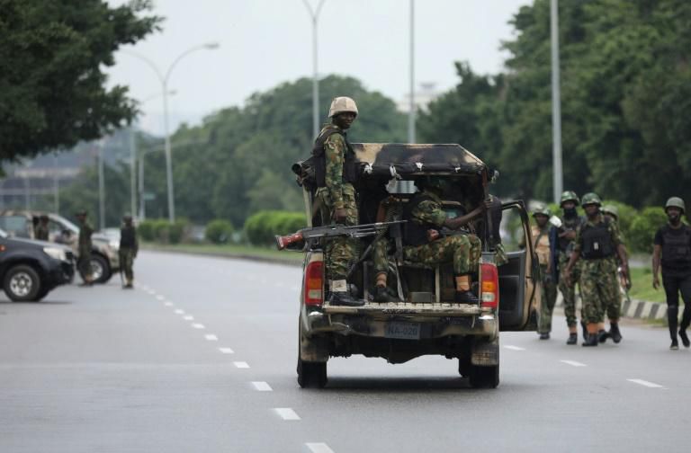 Soldiers aboard a truck patrol during a violent protest by Shiite Muslims demanding the release of their detained leader Ibrahim Zakzaky on July 23, 2019 in Abuja. At least eight people were killed in clashes between Shiite Muslim protesters and Nigeri...