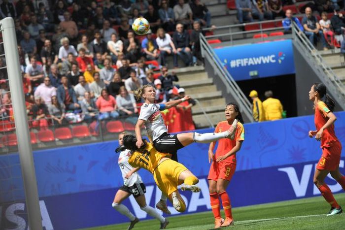 Alexandra Popp clipped the bar with a first-half hedaer but suffered a painful collision with goalkeeper Shimeng Peng