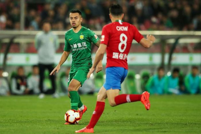 Former Arsenal reserve Nico Yennaris (L, pictured during a Chinese Super League match) is known as Li Ke in China, where there has been intense interest in his assimilation