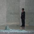 A security guard looks at shattered glass at a shopping mall in Mexico City on July 25, 2019 where two Israelis suspected of mafia links were shot dead in a restaurant.