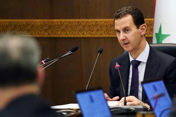 The United States has imposed sanctions on an industrialist tied to President Bashar al-Assad, seen here leading a cabinet meeting in May 2019