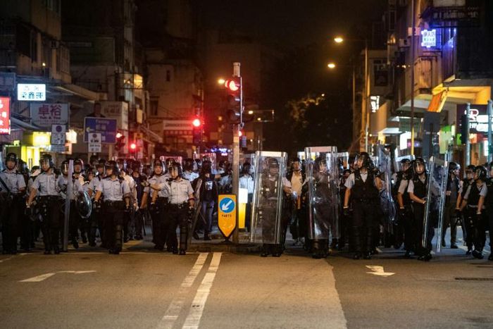 Clashes broke out between Hong Kong police and protesters as marchers took aim at traders coming across the border from mainland China