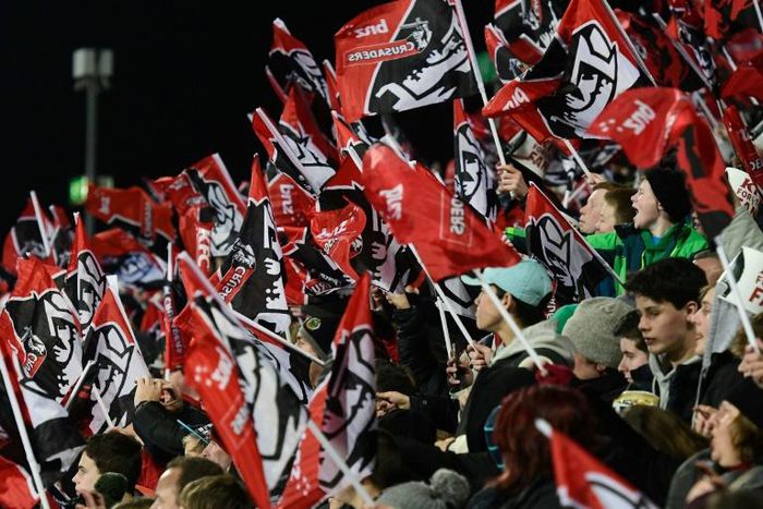 Canterbury Crusaders fans celebrate during a Super Rugby match at their home stadium in Christchurch