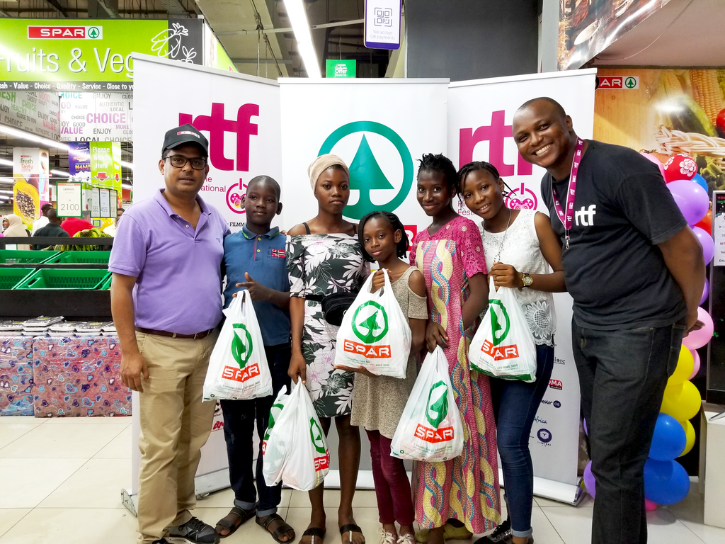 (L-R) John Goldsmith, Group Head, Marketing, SPAR; Folorunsho Suliton; Opeyemi Olagunju; Annabel Ajaegba; Oreoluwa Ayorinde; Hannah Adaja and Stanlee Ohikhuare, Artistic Director, RealTime Film Festival (RTF) with all shortlisted kid actors at the audi...