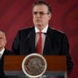 Mexican President Andres Manuel Lopez Obrador (L) listens to Foreign Minister Marcelo Ebrard during a press conference in Mexico City on an immigration deal with the US