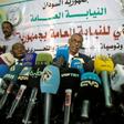 Head of a Sudanese investigative committee Fatah al-Rahman Saeed (C) reveals findings of a probe into the deadly raid on a Khartoum protest camp
