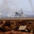 Smoke billows from buildings in the jihadist-held village of Tal Maleh in northwest Syria's Hama province shows on June 9, 2019 as pro-regime forces pound the site
