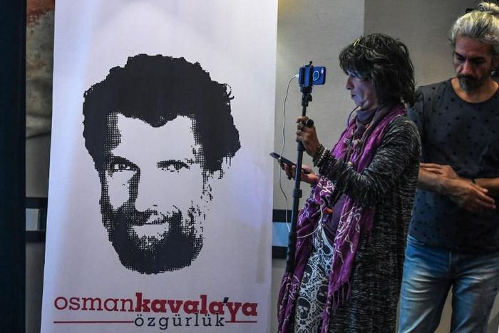Osman Kavala, depicted in a poster at a news conference of his lawyers in October, is one of 16 people accused of orchestrating the "Gezi Park" protests of 2013 -- charges dubbed an absurd sham by critics