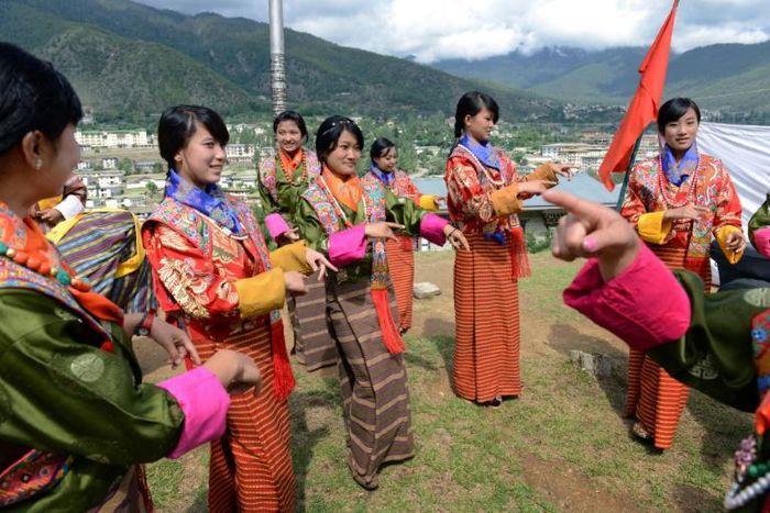 Bhutanese schoolgirls practice a dance. Teachers in the Himalayan kingdom will see a pay rise of 100 percent and allowances