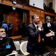 Secretary of Foreign Affairs of India Deepak Mittal (L) and Attorney General of Pakistan Anwar Mansoor Khan (R) greet each other at the International Court of Justice in The Hague earlier this year