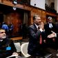 Secretary of Foreign Affairs of India Deepak Mittal (L) and Attorney General of Pakistan Anwar Mansoor Khan (R) greet each other at the International Court of Justice in The Hague earlier this year
