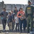 Migrants are loaded onto a bus by US Border Patrol agents after being detained when they crossed into the United States from Mexico on June 01, in El Paso, Texas
