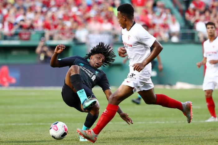 Yasser Larouci of Liverpool is fouled by Sevilla's Joris Gnagnon in Sevilla's 2-1 win in a pre-season friendly at Fenway Park