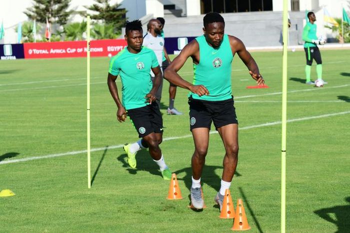 Nigeria forward Samuel Kalu (L) is in a "stable condition" after collapsing during training due to dehydration, the Egyptian Football Association said, amid a sweltering start to the Africa Cup of Nations