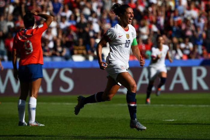Carli Lloyd scored twice and missed a penalty as the USA eased to a 3-0 win over Chile to qualify for the last 16 of the World Cup