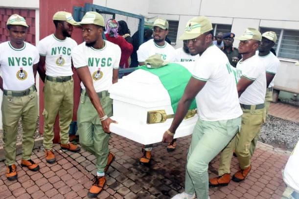 NYSC members carry the remains of their colleague, Mr. Precious Owolabi, who was killed on Monday during a violent confrontation between Police and the Shi’ites. His body left the the National Hospital, Abuja on Tuesday. [NAN image]