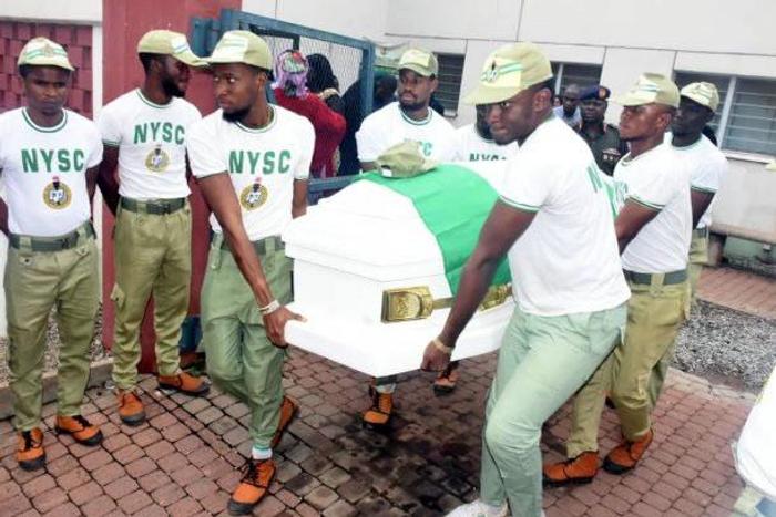 NYSC members carry the remains of their colleague, Mr. Precious Owolabi, who was killed on Monday during a violent confrontation between Police and the Shi’ites. His body left the the National Hospital, Abuja on Tuesday. [NAN image]