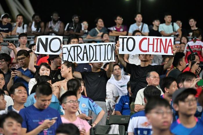Hong Kong demonstrators unfurled banners and sang a protest song during the match which was held after weeks of protests in the city