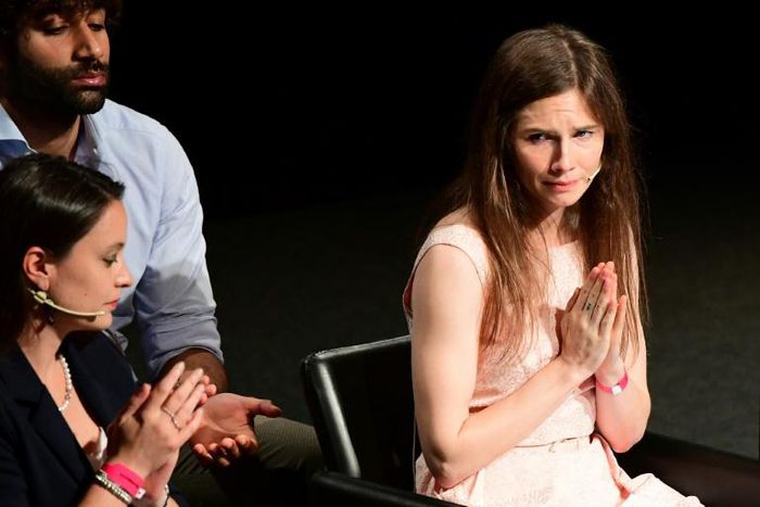 Amanda Knox (R) addresses a panel discussion titled "Trial by Media" during the Criminal Justice Festival at the Law University of Modena, northern Italy on June 15, 2019