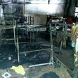 Investigators work after a fire in a shelter for migrants in the town of Velika Kladusa
