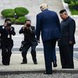 North Korea's leader Kim Jong Un looks on as US President Donald Trump steps into the northern side of the Military Demarcation Line that divides North and South Korea, in the Demilitarized zone (DMZ) on June 30, 2019