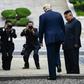 North Korea's leader Kim Jong Un looks on as US President Donald Trump steps into the northern side of the Military Demarcation Line that divides North and South Korea, in the Demilitarized zone (DMZ) on June 30, 2019