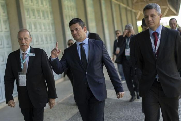 Justice Minister Sergio Moro (center) was the anticorruption judge who handed Lula his first conviction in 2017, which prevented him from running in a presidential election he was widely expected to win