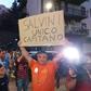 A man holds a placard reading "Salvini is the only captain"