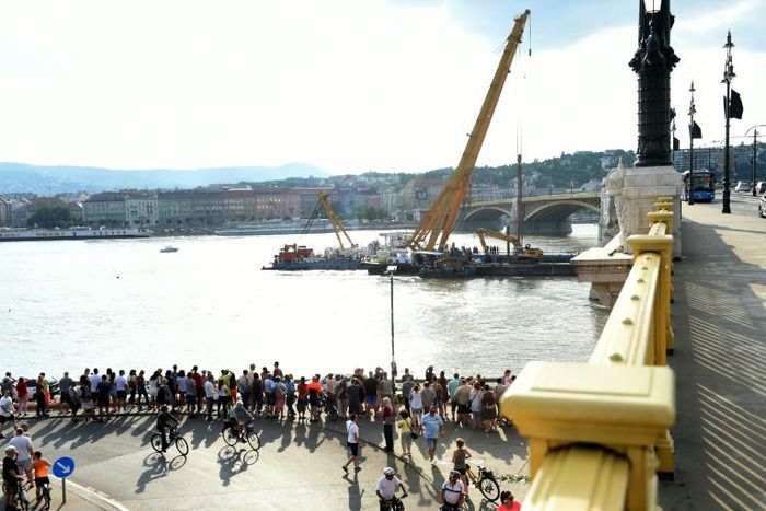 A police spokesman said Monday that the lifting operation could take six hours, and will be phased to allow divers to search the vessel for any victims still inside