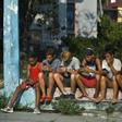Young Cubans connect to the internet from their mobile phone in Havana, on June 6, 2019