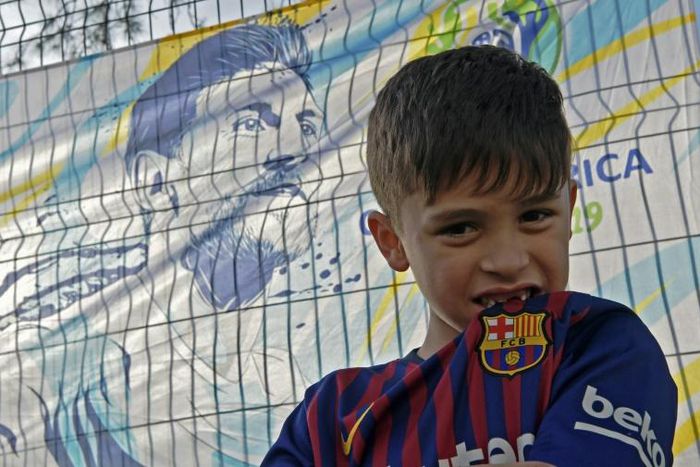 Brazilian six-year-old Lionel Messi Maier waits in vain to catch a glimpse of his Argentine hero and namesake